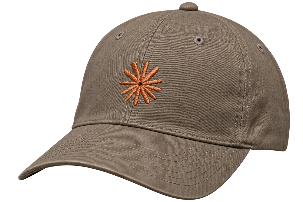 Warm brown baseball cap with Claude's orange starburst embroidered on the front