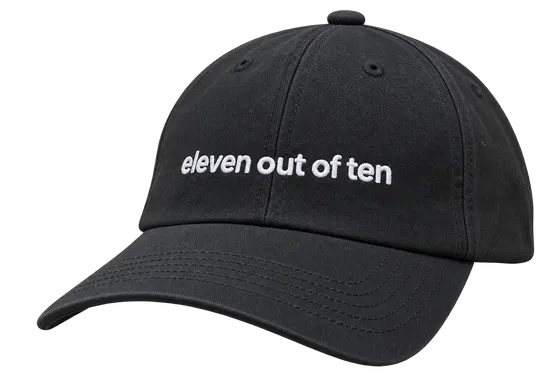 Black ElevenLabs cap with "eleven out of ten" embroidered in white across the front