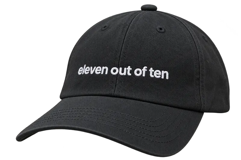 Black ElevenLabs cap with "eleven out of ten" embroidered in white across the front