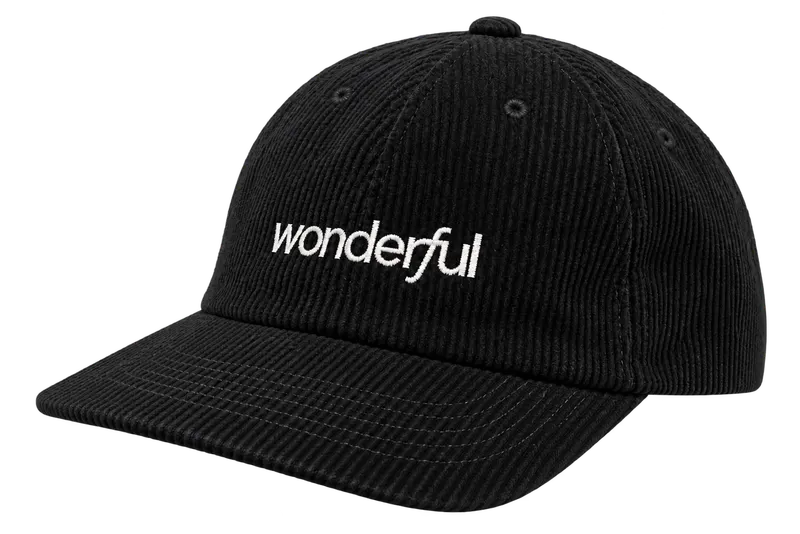 Black corduroy cap with a white lowercase Wonderful wordmark embroidered across the front