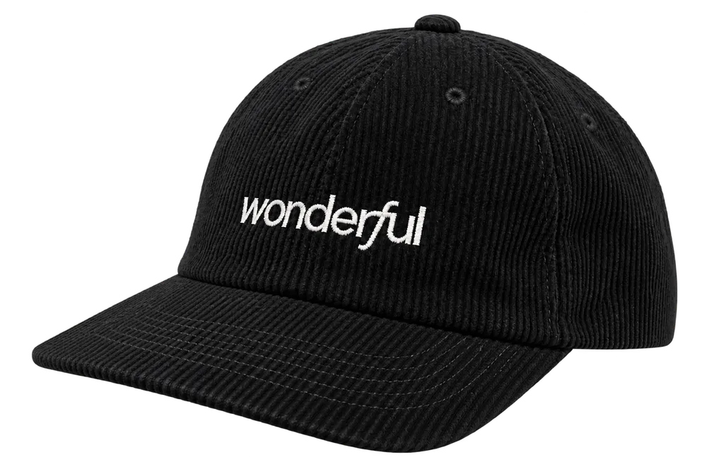 Black corduroy cap with a white lowercase Wonderful wordmark embroidered across the front